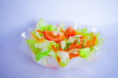 Salad in a bowl with white backgroundの写真素材