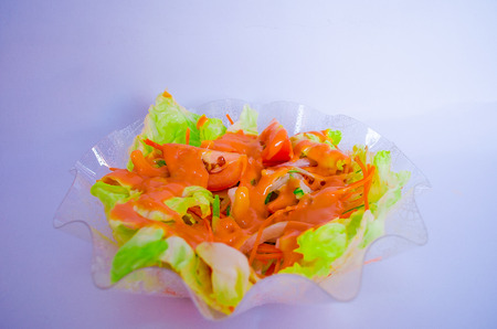 Salad in a bowl with white background thousand island toppingの写真素材