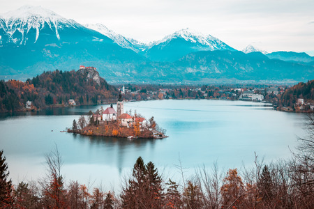 View of Bled Lake during Autumn with Bled Castle and snow and mountains in background, Bled Lake, Sloveniaのeditorial素材