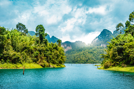 Mountain scenery with with tropical rain forest in the background and blue water lake in the...