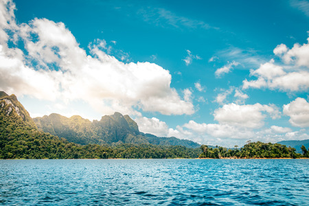 Mountain scenery with with tropical rain forest in the background and blue water lake in the...