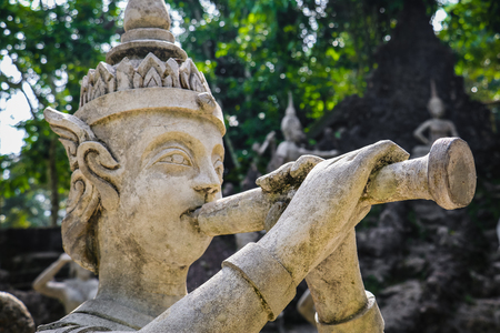 Ancient stone statues in Secret Buddhism Magic Garden, Koh Samui, Thailand. A place for relaxation and meditation.の写真素材