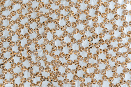 Natural abstract background with interconnected bamboo and white woolen cloth pattern