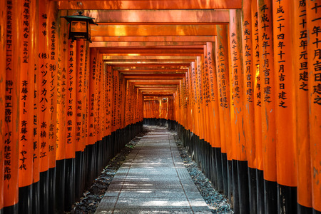 Japanese red Torii gates with black writings in Fushimi Inari-taisha Shrine, Kyoto, Japanのeditorial素材