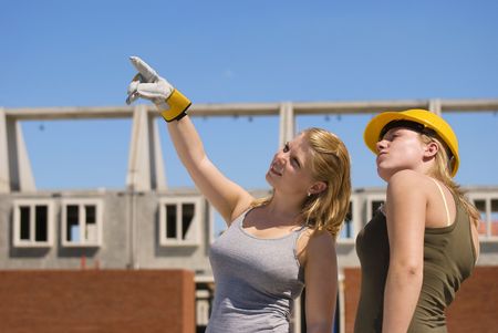 Two female students at a contruction site.の写真素材