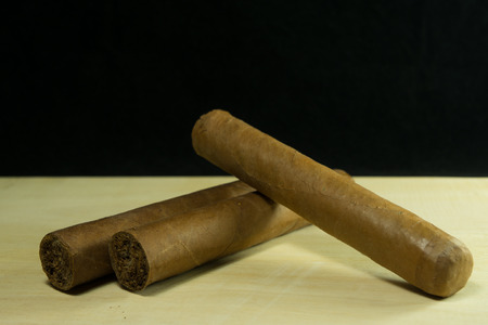 Snuff cigars put on plank.