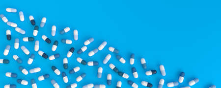 many blue pills diagonally poured on a blue background, 3d illustration