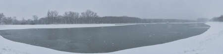 beautiful winter countryside panoramic landscape with river viewsの写真素材