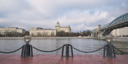 View of the Moscow River near the railway bridge in cloudy weatherの写真素材