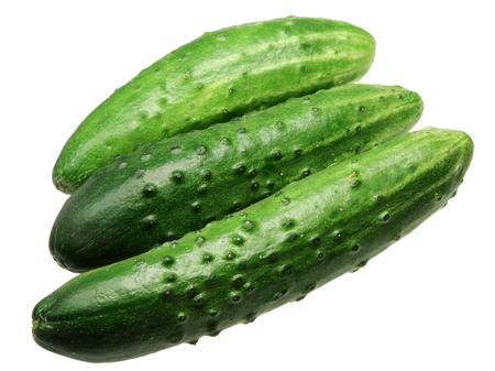 Green ripe cucumbers it is isolated on a white backgroundの写真素材