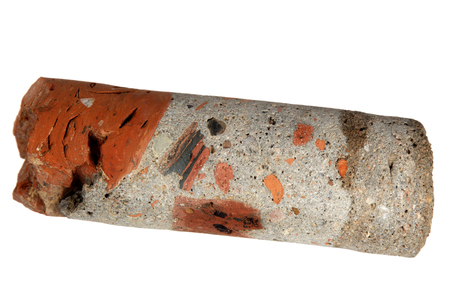 Piece of a core of a well from the base of the ancient building on a white background の写真素材