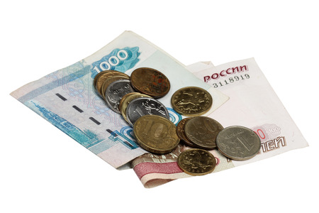 Notes hundred and thousands of rubles and a coin on a white backgroundの写真素材