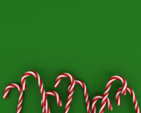 A lot of christmas candies on green backgroundの写真素材