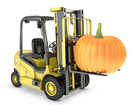 Yellow fork lift truck lifts orange pupmkin, isolated on white backgroundの写真素材