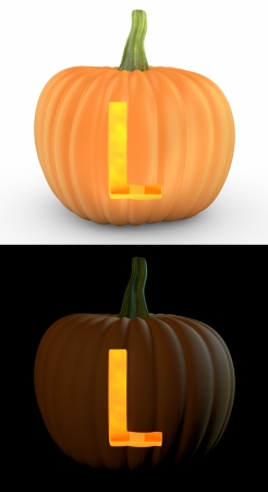 L letter carved on pumpkin jack lantern isolated on and white backgroundの写真素材
