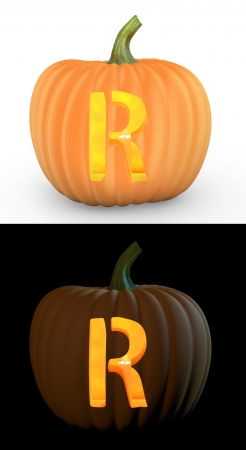 R letter carved on pumpkin jack lantern isolated on and white backgroundの写真素材