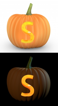 S letter carved on pumpkin jack lantern isolated on and white backgroundの写真素材