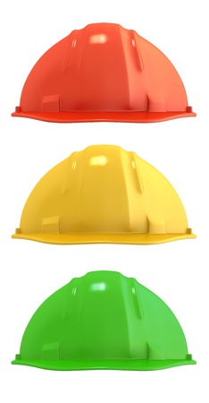 Three construction helmets colored as traffic light, isolated on white backgroundの写真素材