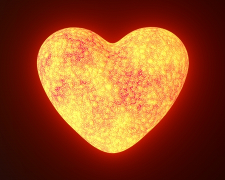 Red hot metal glowing heart isolated on blackの写真素材