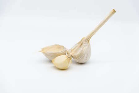 garlic dried cloves on a white background. copy space for textの写真素材