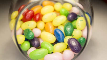 Wonderful photo with delicious colorful jelly beans. Tasty candies. Bright sweet beans in the glass.の写真素材