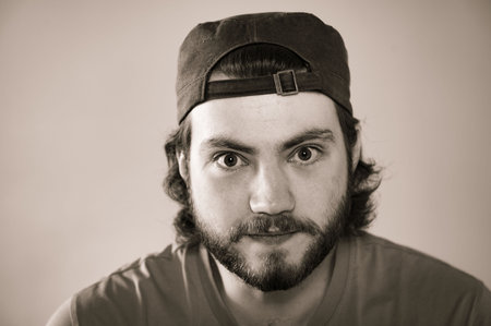 Monochrome portrait of young bearded man face looking at camera,black and whiteの写真素材