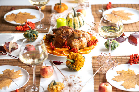 Baked whole chicken or turkey for Christmas. Thanksgiving table with decoration, homemade roasted...