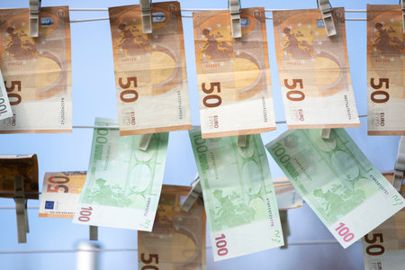 100 and 50 euro banknotes drying. Washed Euro paper bills. Drying euro on a string.Money...