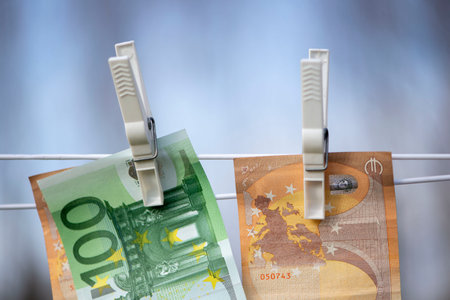 100 and 50 euro banknotes drying. Washed Euro paper bills. Drying euro on a string.Money laundering.Dirty moneyの写真素材