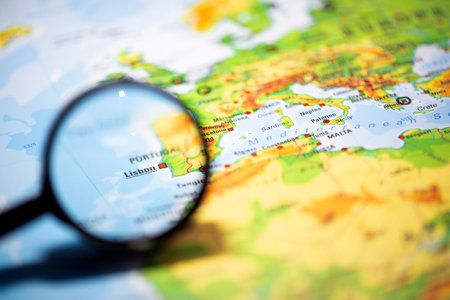 Close-up fragment of a world map with selective focus isolated on Lisbon,Portugalの写真素材