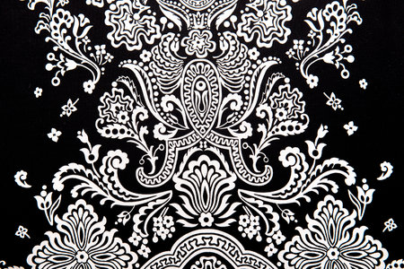 vintage abstract white floral pattern on black  textiles fabric, retro backgroundの写真素材