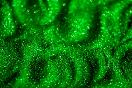 Shiny green glitter textured background