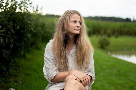 Portrait of young natural woman on green nature backgroundの写真素材