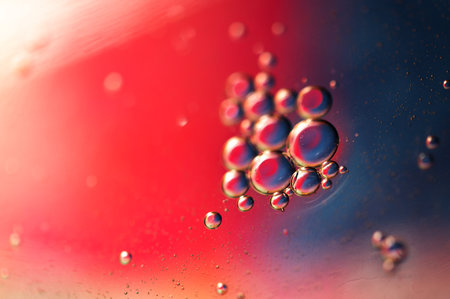 Oil in water, abstract background in blue and red color tonesの写真素材