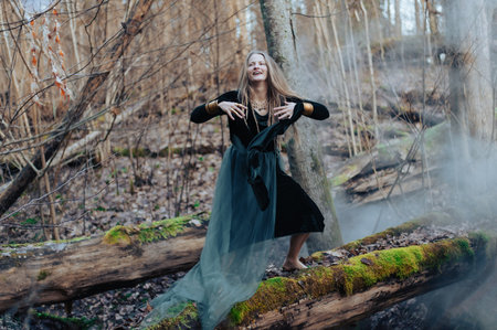 Female shaman in pristine forest nature on white smoke fog background