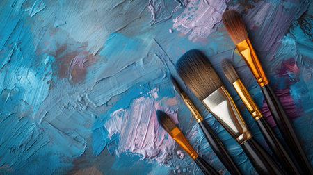 Paint brushes on paint backgroundの素材