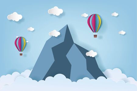 Origami made colorful hot air balloon flying over the mountain with cloud.paper art style.のイラスト素材
