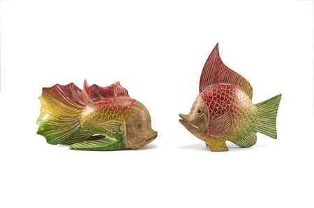 Handcraft wooden fish isolated on white backgroundの写真素材