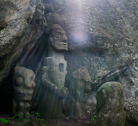 Ancient Indonesian anthropomorphical sculptures carved from stone, Ambarita Stone Chairs, Lake Toba, Indonesiaの写真素材