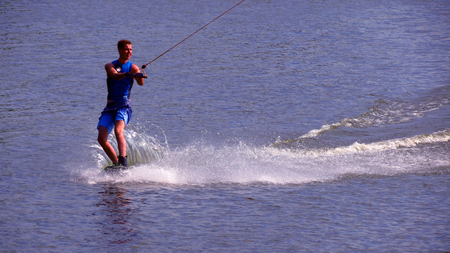 Wakeboarder rides a board in the sunny day. Belarusのeditorial素材