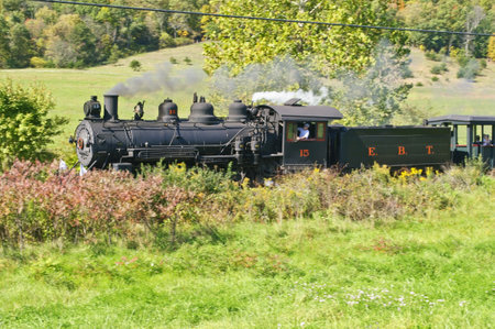 10/08/2011 Orbisonia Pennsylvania during East Broad Top railroads fall extravaganza engine #15 a 1914 Baldwin mikado races along narrow gauge tracks pulling tourist on a sunny fall dayのeditorial素材