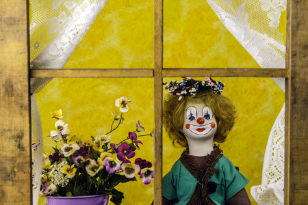 antique porcelain doll wearing spring weathの写真素材