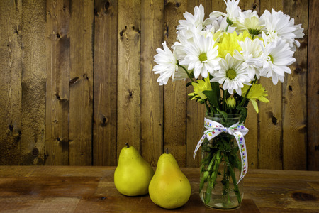 flower bouquet in glass mason jar with pearsの写真素材