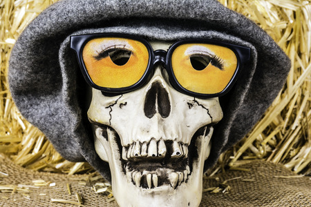 Halloween skull with 3D glasses and wool capの写真素材