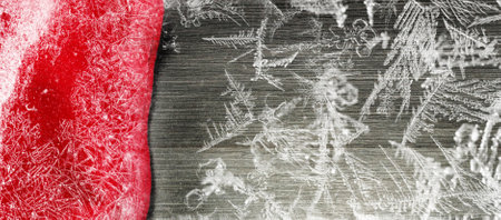 Festive Christmas holiday winter background with bright red tablecloth  covered sparkling snowflakes on rustic wooden table. Frost patternの写真素材
