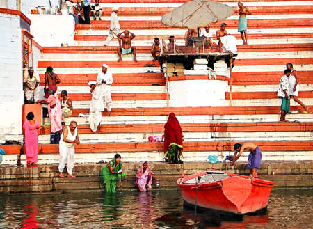 Varanasi, India - october, 20,2014: boat at the river Ganges near holy ghats with people in Varanasi, India early morningのeditorial素材
