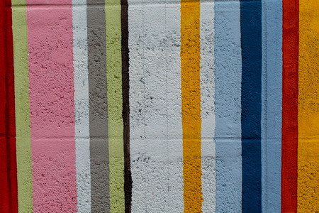 Rainbow colorful brick wall - beautiful variety colors cement pattern backgroundの写真素材