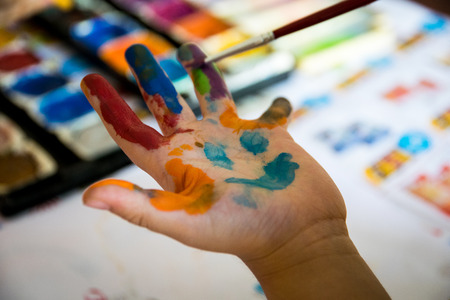 Smiling colorful children handsの写真素材