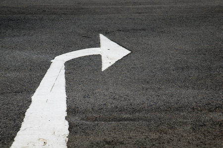 arrows painted on a cement floor.の写真素材