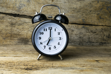 Morning alarm clock on table